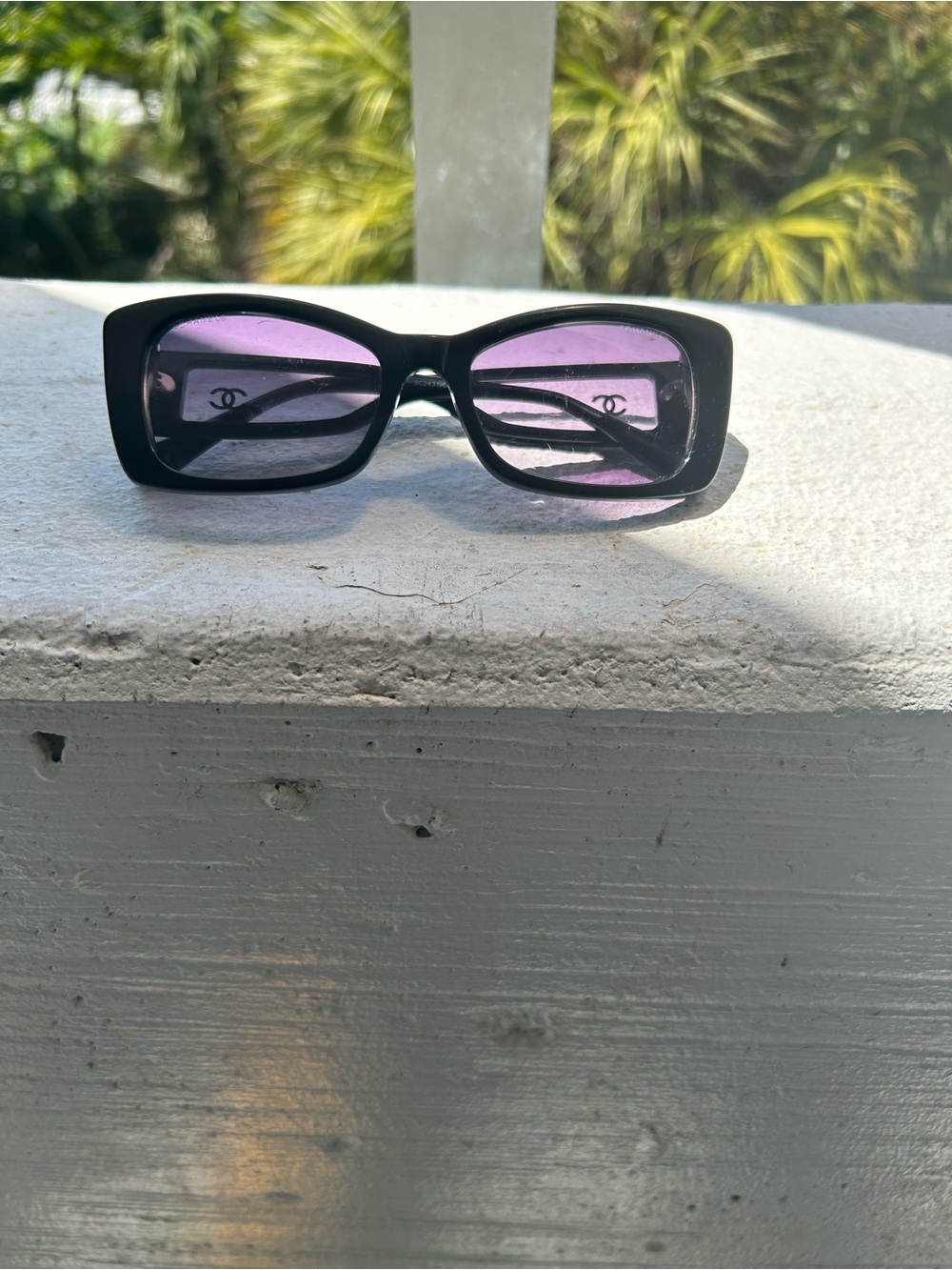 CHANEL Black Frame Sunglasses with Purple Lenses